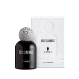 black bell shaped glass bottle with white lettering topped with a round crackle top
