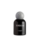 black bell shaped glass bottle with white lettering topped with a round crackle top