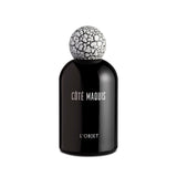 black bell shaped glass bottle with white lettering topped with a round white crackle top