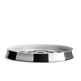 Black and white checkerboard glaze pattern on a low, round porcelain platter.