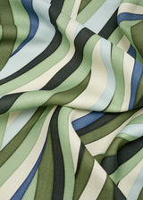 Linen rectangular tablecloth  with an organic, undulating pattern in blue, green and ivory hues.
