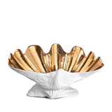 Neptune Bowl - X-Large. White porcelain shell-shaped bowl with gold interior floating on a base.