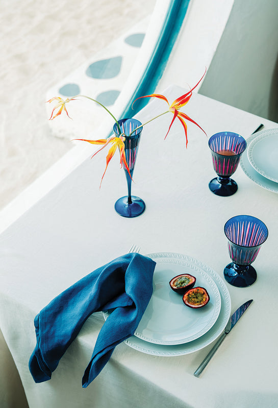 Summer Tablescape with Bright Blue Glassware and White Porcelain Dinnerware