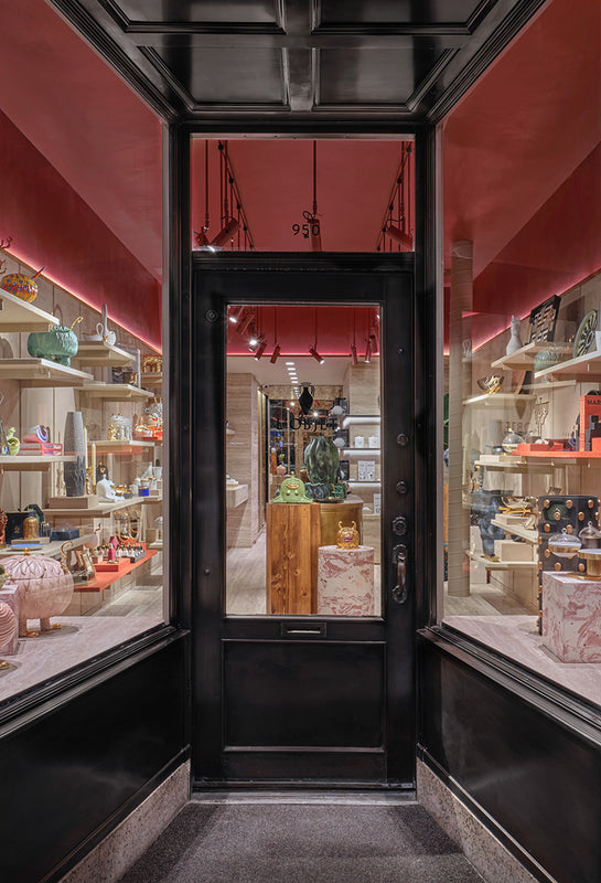 Discover L'OBJET Madison Avenue. Located in New York City. Image of exterior of store with decor items arranged throughout the store in pink and beige hues.