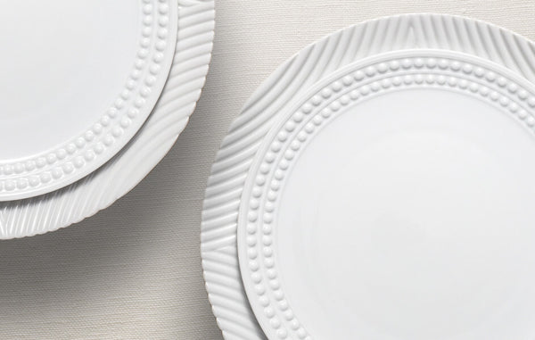 White porcelain Corde charger plate with arched strand motif, Perlee white dinner plate.