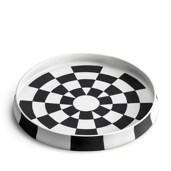 Black and white checkerboard glaze pattern on a low, round porcelain platter.