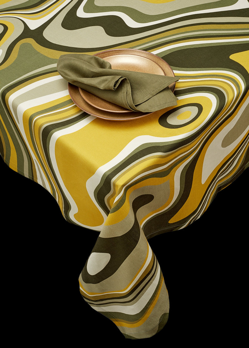 Linen rectangular tablecloth with an organic, psychedelic pattern in muted green, yellow, brown and ivory hues.