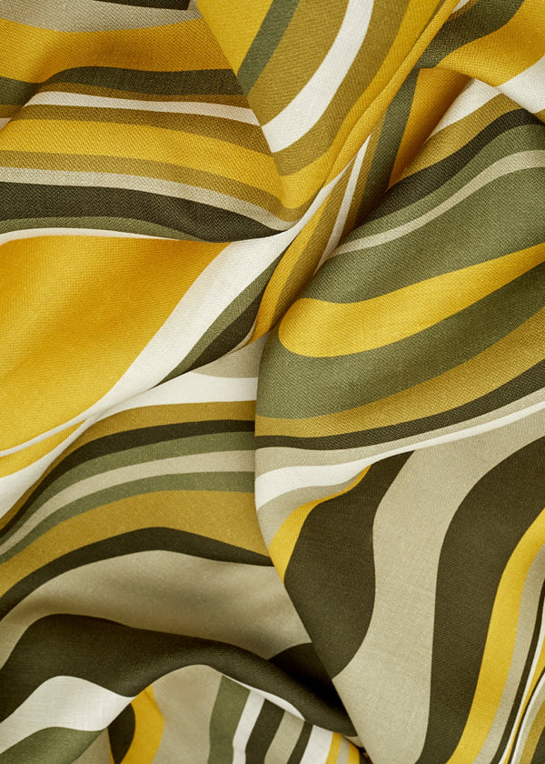 Linen rectangular tablecloth with an organic, psychedelic pattern in muted green, yellow, brown and ivory hues.