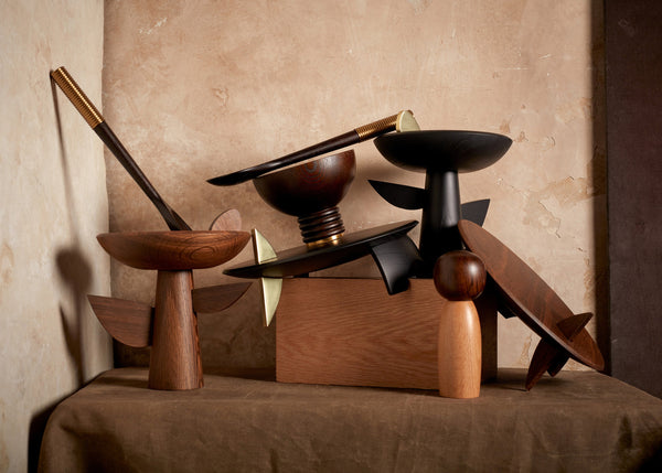 Collection of wooden decorative bowls from L'Objet kelly behun collection and Alhambra wood serving utensils.