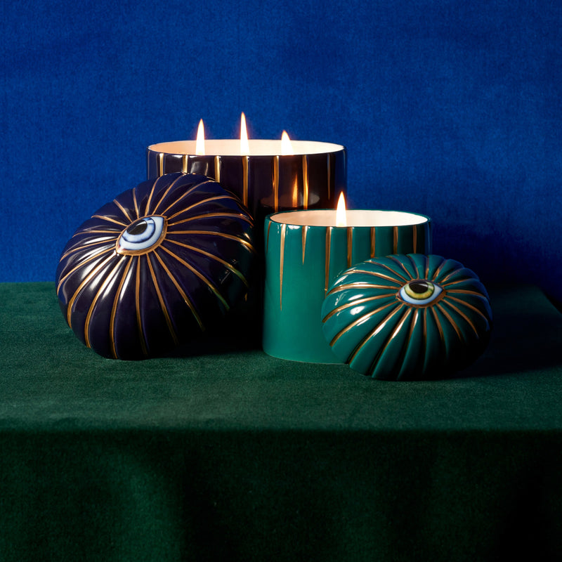 blue and green Lito candles posed together and styled moody blue and green background