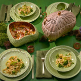 Tabletop with L'Objet Haas Brothers Matcha green dinnerware and pink Lukas Soup Monster Tureen